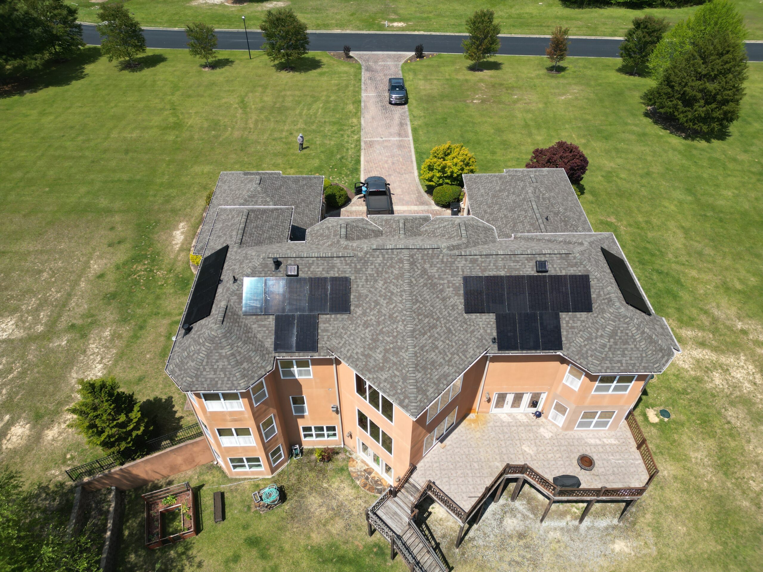 Big house with solar panel on backside of roof